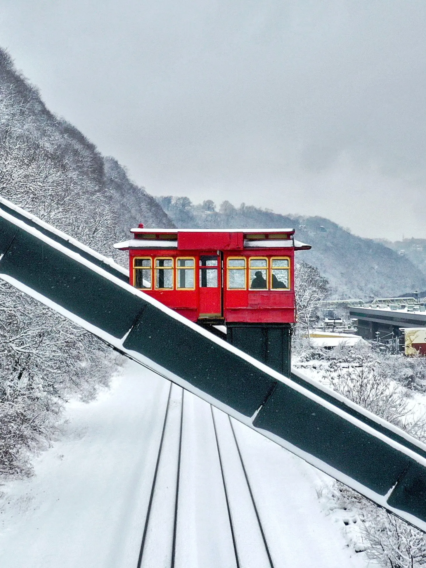 centered incline cart on a snowy backgroud